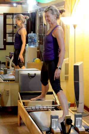 Picture of Client Exercising on a Reformer 4